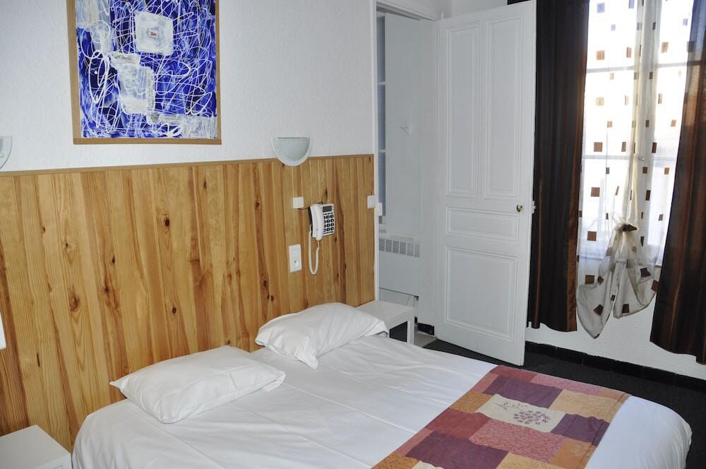 Foto de una habitación de Citotel Hôtel Cesar