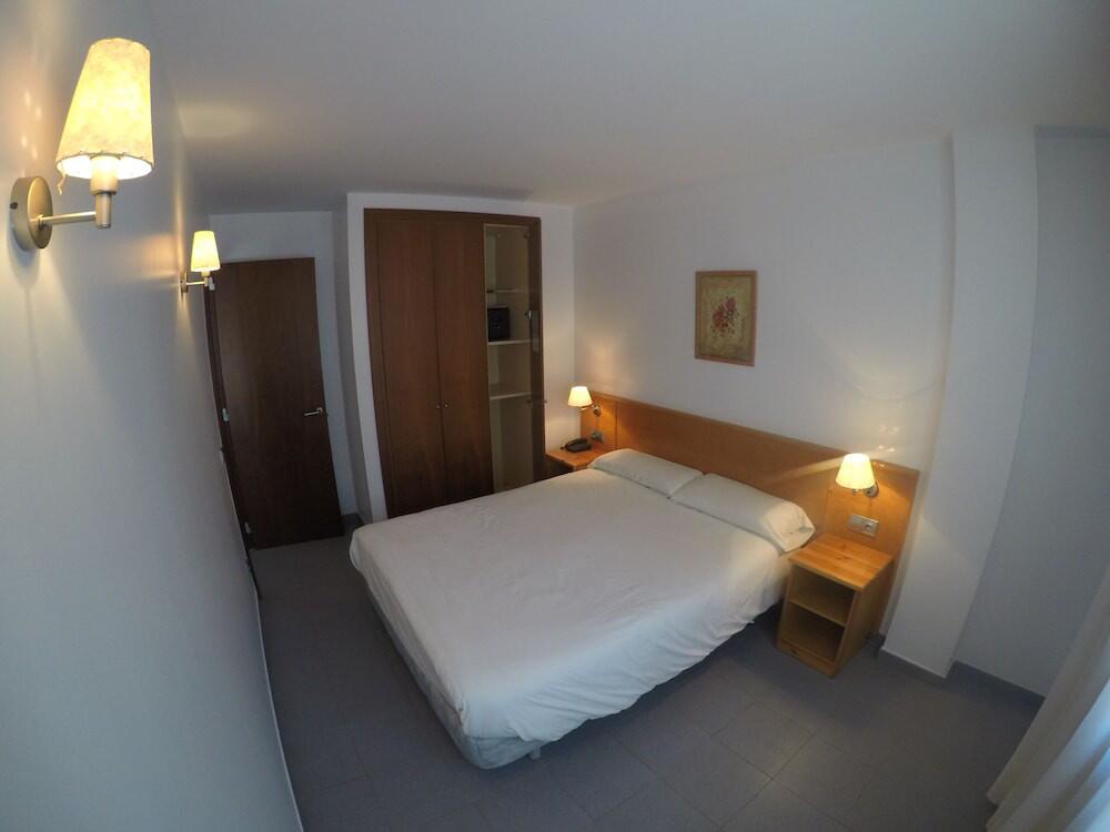 Foto de una habitación de Apartamentos Turísticos Roc Del Castell