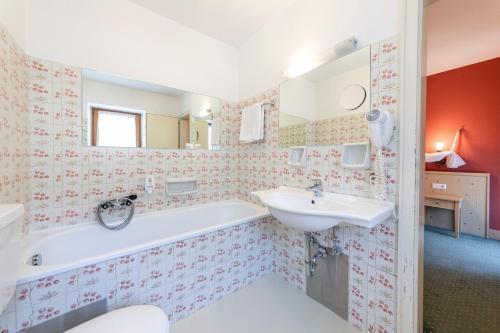 Foto de una habitación de Hotel Dolomiti