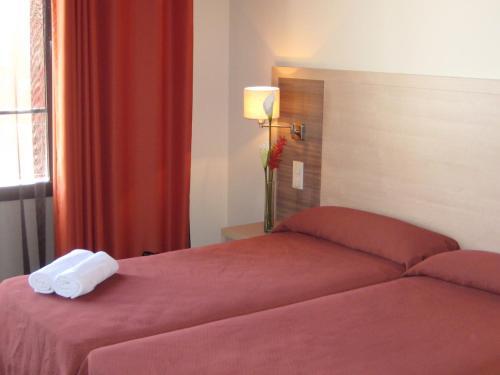 Foto de una habitación de Hotel Residència Erasmus Gracia