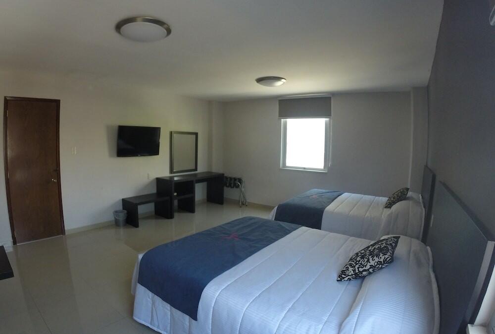 Foto de una habitación de Hotel HAUS Express