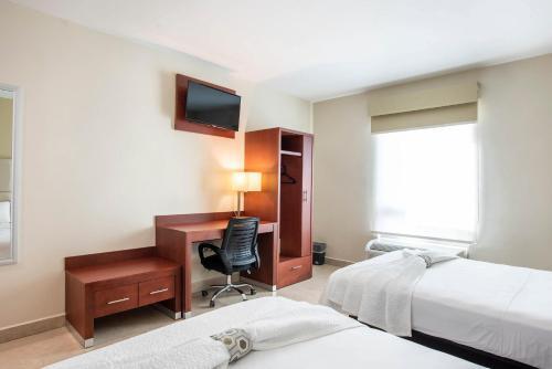Foto de una habitación de Hotel Ave Inn